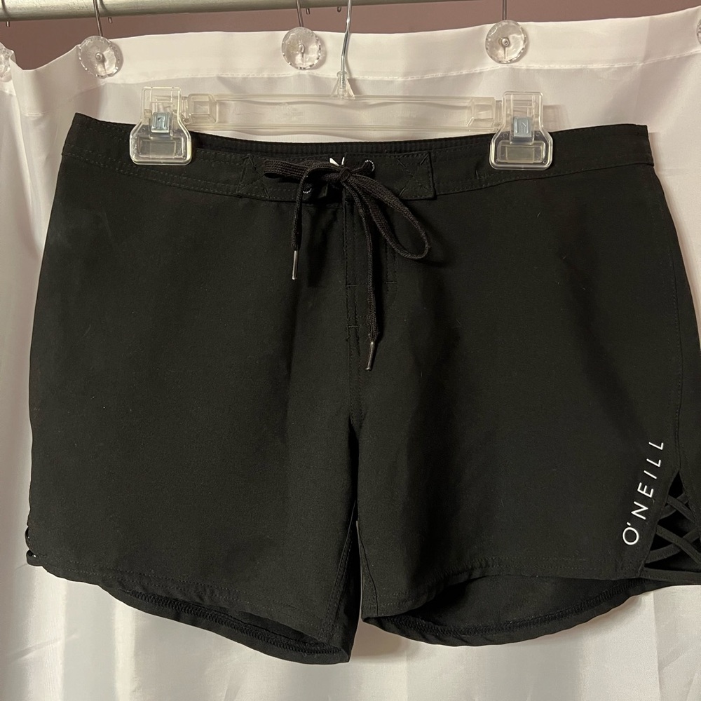 O’Neill swim short. Black. Waist approximate 16”. Cute cut out pattern each leg